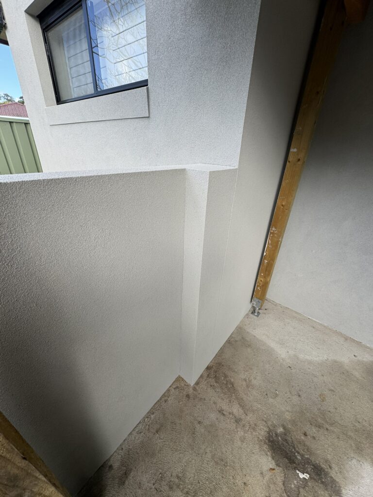 Smooth render finish on residential exterior wall