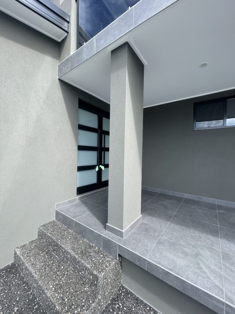 Rendered entrance columns and exterior walls on Wollongong home